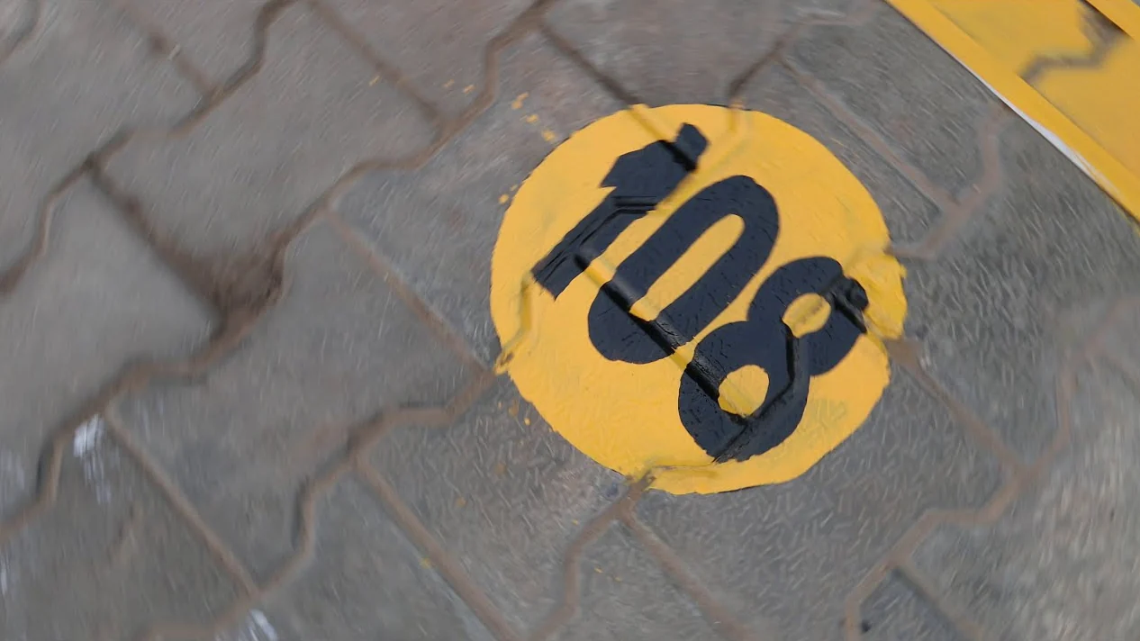 A painted bay number on the yard floor